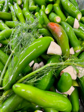 Load image into Gallery viewer, close up of fresh serrano chili peppers with chopped garlic and herbs
